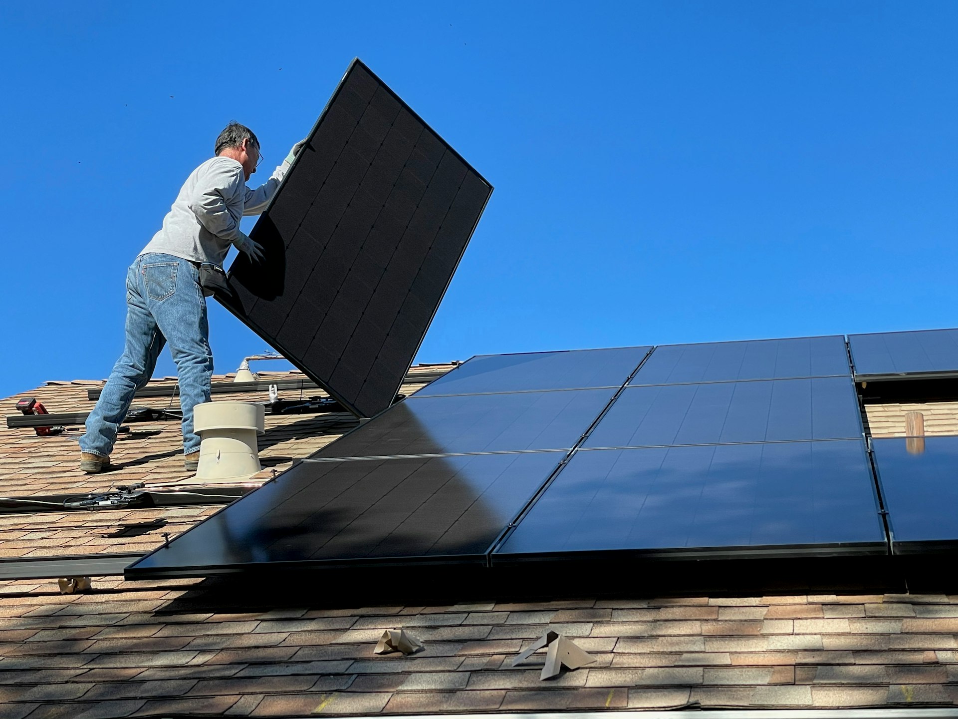 Technicians installing solar panels